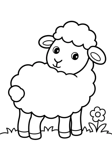Mouton souriant à la laine bouclée debout dans l'herbe près d'une fleur